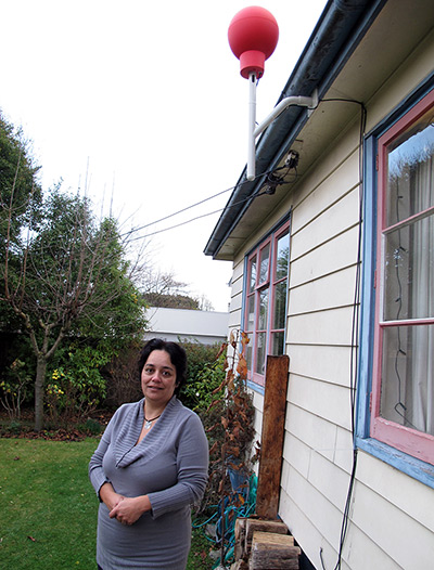 a new zealand resident with her red Google internet receiver